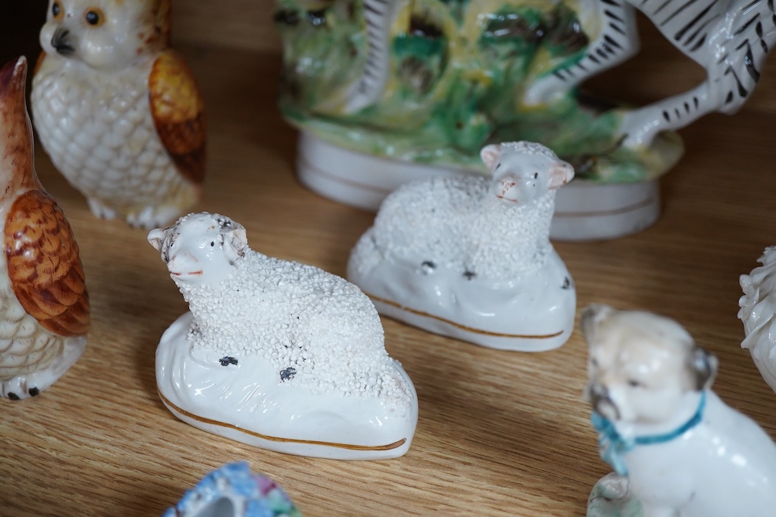 A pair of Worcester 'owl' candle snuffers, Staffordshire Zebra and two sheep, Belleek etc zebra 19cm wide.